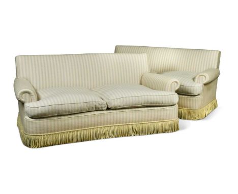 A pair of deep two seat sofas, modern, the rectangular backs over slightly concave seats, upholstered in a blue and white str