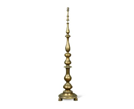 A brass standard lamp, early 20th century, the baluster column on stepped circular base and three feet137cm high