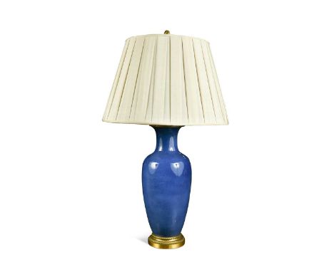 Powder blue glazed lamp by E F Caldwell & Co Inc, New York, of baluster form with finely cast gilt metal mounts and flamiform
