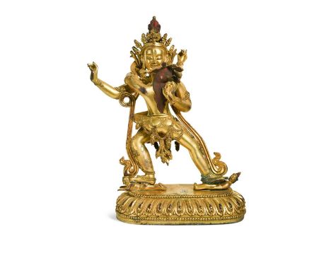 A Tibetan-style gilt bronze figure of Samvara with his paredra Yab-yum, 20th century, on a lotus dais32.5 x 21cm