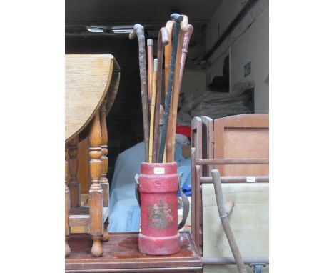 STAND BEARING COAT OF ARMS AND SWAGGER STICK PLUS WALKING STICKS, ETC. 