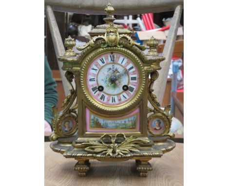 HIGHLY DECORATIVE GILT METAL FRENCH STYLE MANTEL CLOCK WITH HANDPAINTED AND ENAMELLED FACE AND PANELS, APPROXIMATELY 28cm HIG