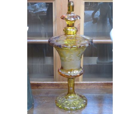 AMBER COLOURED ANTIQUE STEMMED GLASS JAR WITH COVER WITH MARY GREGORY STYLE DECORATION, APPROXIMATELY 29cm HIGH (AT FAULT)