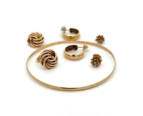 A 9ct gold bangle and 3 pairs of 9ct gold earrings including a flower design pair with diamond accent (not original backings)