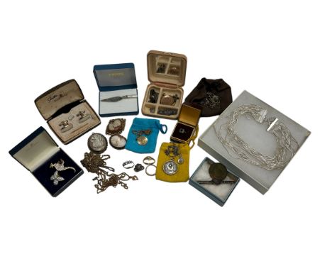 A collection of silver and costume jewellery items including some cameo brooches, silver sombrero pendant necklaces, an ameth