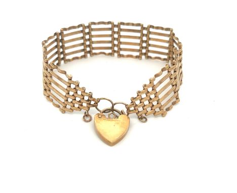 A 9ct gold gate link bracelet - Hallmarks for Sheffield on padlock and on links. One gate is bent out of shape at the bottom.