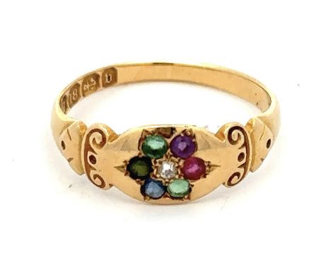 An 18ct gold multi gemstone ring with scroll shoulders, set with diamond, emerald, sapphire, ruby, amethyst etc. Size N, 2.7g