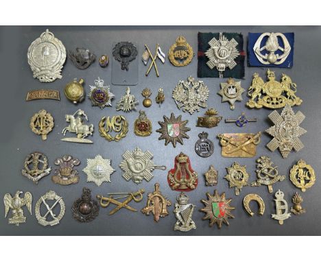 Assortment of Cap Badges, some better, to include; Assaye (x2), Royal Army Service Corps, Lancastrian, North Stafford, RFC, M