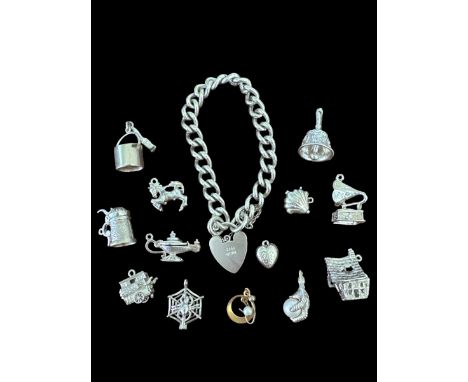 A silver charm bracelet and a number of loose charms. 75g approx.Please see sale description/information for conditions on bu