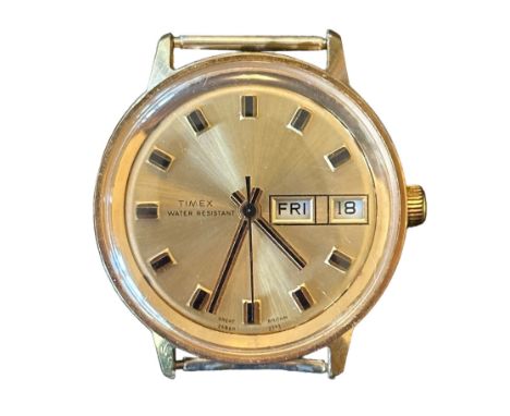 Timex 1973 water resistant watch with stainless steel back (missing bracelet) Day and date display, baton hour markers. Watch