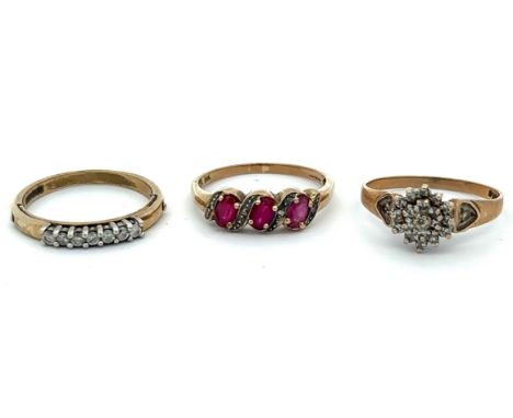 Three 9ct gold rings. Ruby with diamond accents, size T, 7 stone diamond ring size R, diamond cluster style ring size S.Pleas