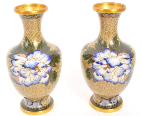 A pair of vintage 20th century Cloisonn&eacute; stem / bud vases. In a yellow ground with metal work, floral design and circu