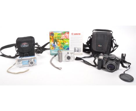 Canon - A collection of Canon digital cameras. The collection to include a Canon PowerShot A70 compact digital camera in orig