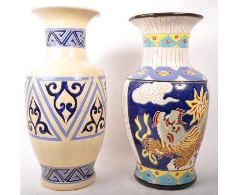 Two vintage 20th century ceramic pottery vases. Flared rim, tapering necks into bulbous body. Hand painted decoration, one fe