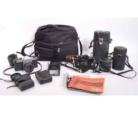 Pentax - A collection of vintage 20th century Pentax SLR cameras, with accessories, lenses. With carry bag.&nbsp;