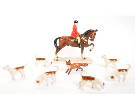 Beswick - A collection of six vintage 20th century Beswick porcelain hunting scene beagle dogs and a single Beswick fox. Toge