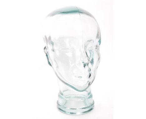 A vintage 20th century pressed green clear glass milliners / phrenology type head bust having moulded features and hair. Meas