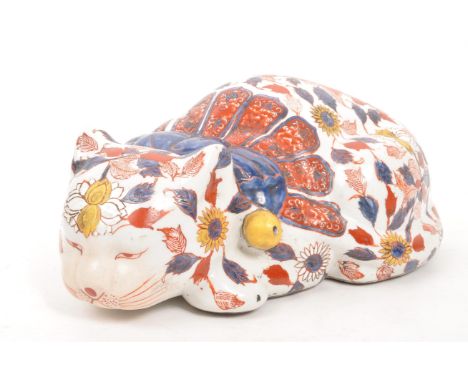 A large early 20th Century ceramic Chinese imari figure in the form of a sleeping cat. Signed to base. Measuring approximatel