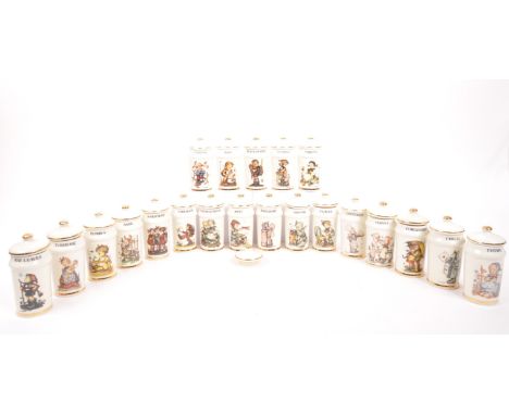 H J Hummel - A collection of twenty one German china lidded spice pots by H J Hummel each with description of spice and figur