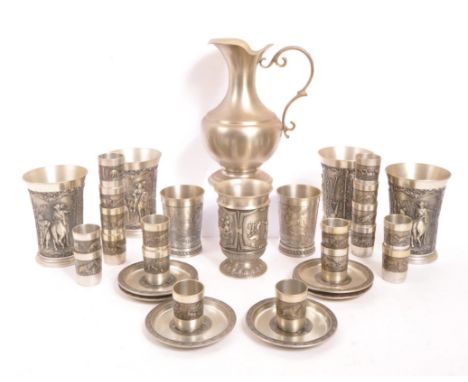 A collection of 20th Century German pewter items stamped SKS Zinn 95% to base. To include 4x ale / beer beakers with heavy re
