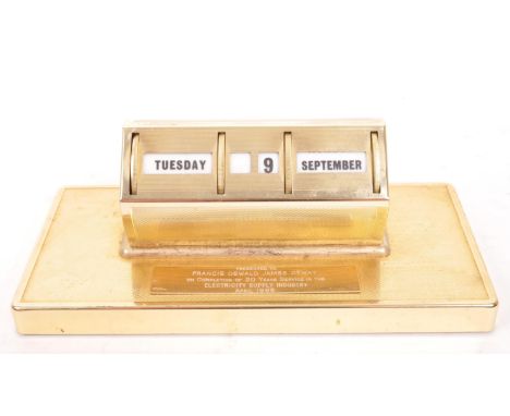 A 20th Century vintage 1980s metal desktop perpetual calendar raised on rectangular base. Having rotational mechanism to chan