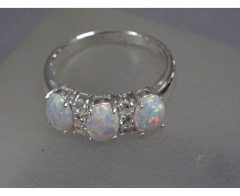 Silver three stone opal set dress ring