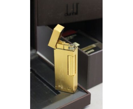 Boxed Dunhill lighter with papers and spare flints