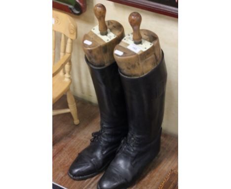 Pair of hunting boots with trees