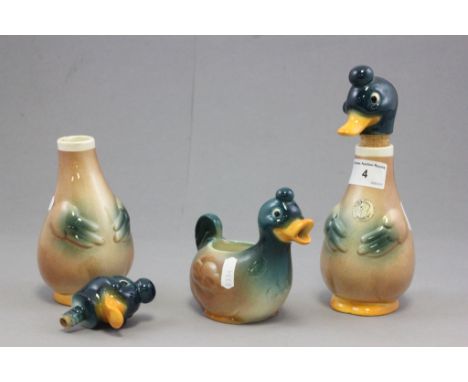 A Goebel ceramic cream jug in the form of a duck, along with matching pair of decanters 