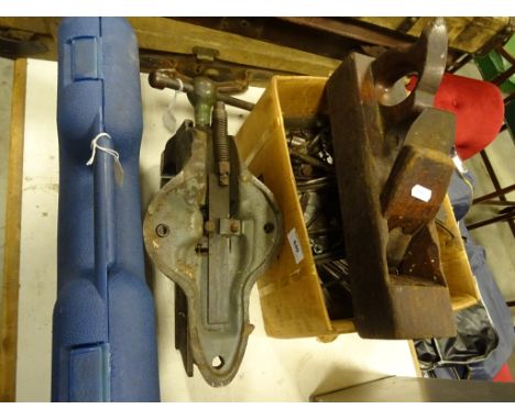 A collection of tools including planes, vices and other items