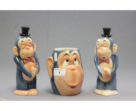 A Goebel monkey character mug and two matching decanters