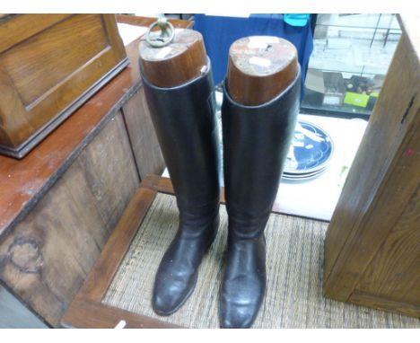 Pair of hunting boots with trees