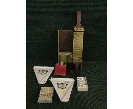 An early 20th century wooden and brass pill dispenser, two Panadol ceramic pill dispensers, boxed medical syringes etc 