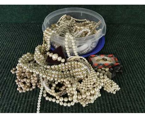 A box of simulated pearls, watch, tie clip etc 