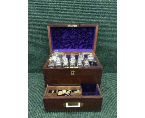 A Victorian mahogany chemist's box fitted with bottles and scales