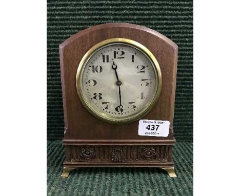 A mahogany mantel clock on brass bracket feet 