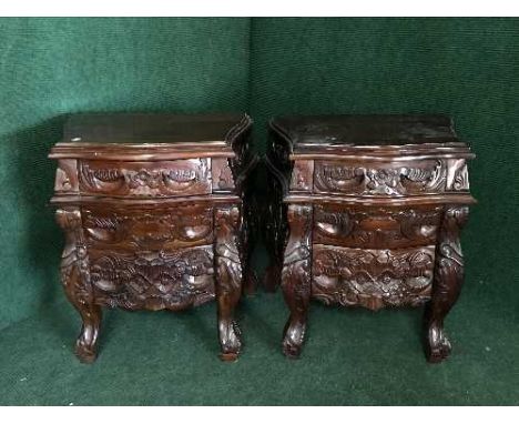 A pair of carved mahogany commode chests 