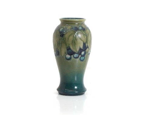 A Moorcroft grape and leaf pattern baluster vase, with impressed and painted mark beneath,18cm highCondition ReportRestoratio