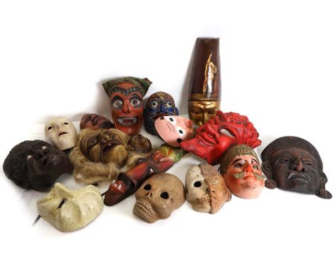 A collection of masks,  including Japanese Hyottoko masks, and Tibetan examples, largest 43cm high (qty) Provenance: The Cloc