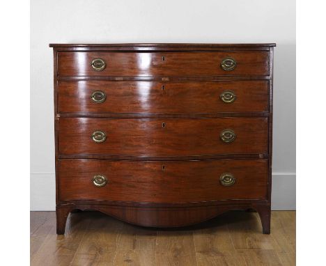 A George III mahogany serpentine chest of drawers, late 18th century, the shaped top above four deep drawers fitted with bras