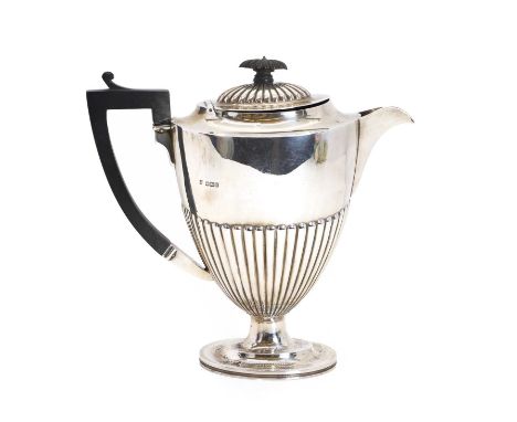 A silver hot water jug, by Martin Hall &amp; Ltd, Birmingham 1924, with reeded detail and ebonsied handle and finial,24cm hig