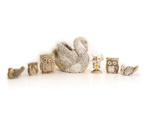 A collection of shell birds, comprising a large swan vessel, 25.5cm high, owls, and two doves (qty.)Condition ReportLoss to t