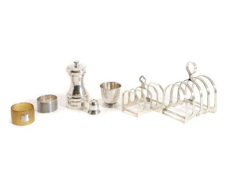 A silver pepper grinder, by J A Campbell, Birmingham 1987, of typical form, 10cm high, together with two silver four division