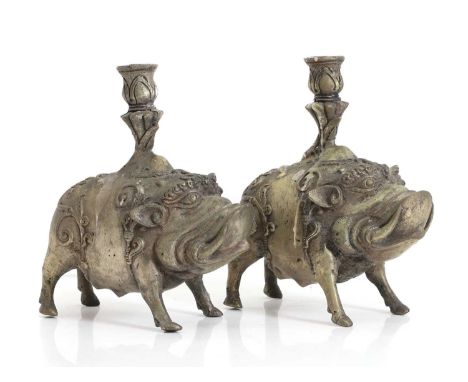 A pair of candlestick holders in the form of boars,  possibly Chinese, 19.5cm   Provenance: The Clock House, Dunmow, Essex