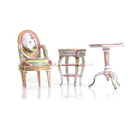 Dolls house furniture, three French pottery pieces, late 19th to early 20th century, a fauteuil, a three-tier etagere and a t