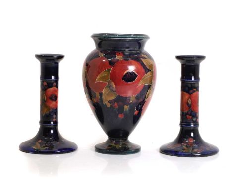A William Moorcroft 'Pomegranate' pattern pottery vase, of baluster form, impressed and painted marks,22.5cm hightogether wit