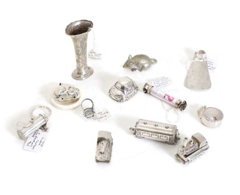 A silver rabbit form teething ring with a white celluloid ring, 8cm high, together with a filled silver model VW Beetle by Ma
