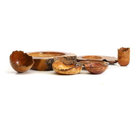 A collection of naturalistic turned wooden bowls, including a large bowl with shallow basin, 44cm wide, two burr examples by 