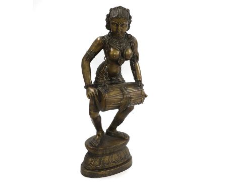 A large Indian bronze figure of a deity,  20th century, holding a drum,  99.5cm highProvenance: The Clock House, Dunmow, Esse