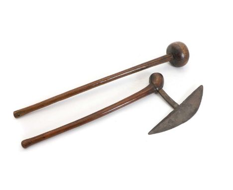 A Zulu axe, 19th century, South Africa, the tapering shaft with bulbous head, issuing a crescent shaped iron blade with cross